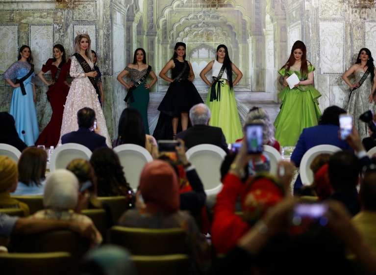 Participants wait for judges to determine the winner of Miss Iraq during the final round of judging in Baghdad, Iraq, May 25, 2017. (Photo: Reuters)